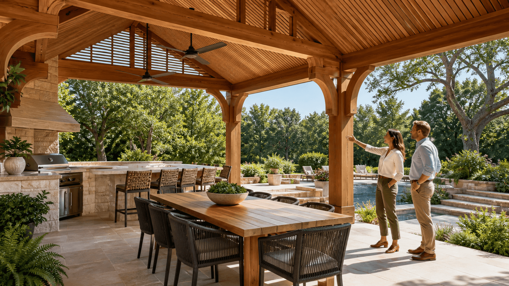Sunlit wooden dining pavilion with white tables and greenery beneath a clear blue Birmingham sky.